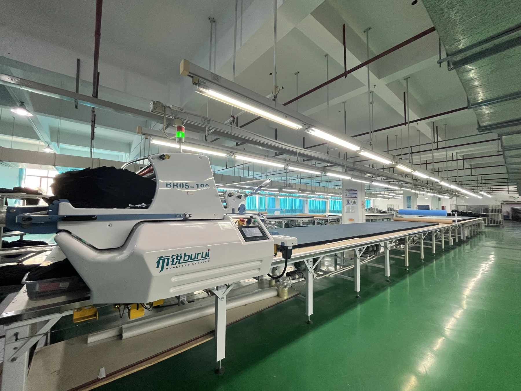 Automated fabric spreading and cutting